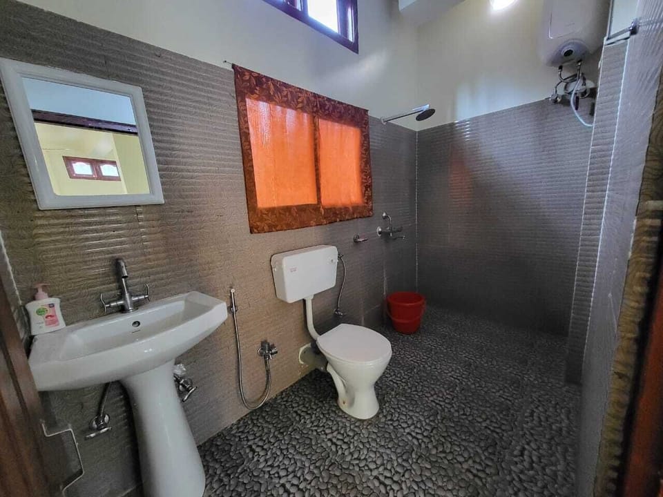 Shower, rainfall showerhead, slippers, towels