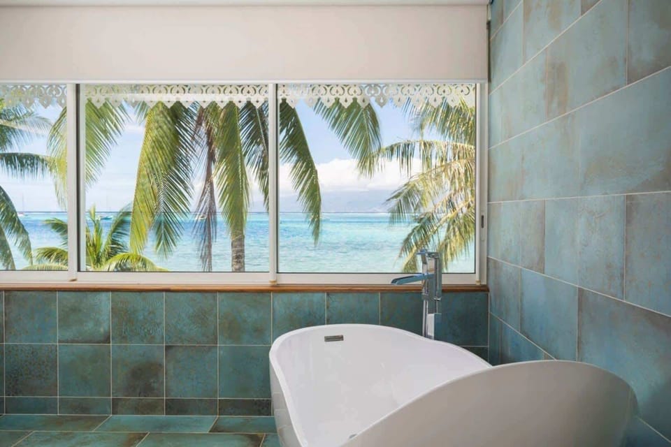 Relaxing bathtub with ocean outlook.
