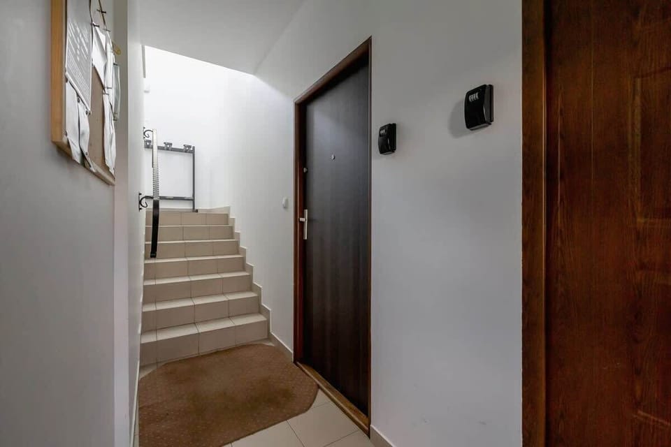 An indoor staircase leading to the upper floors, showcasing a clean and well-maintained interior.






