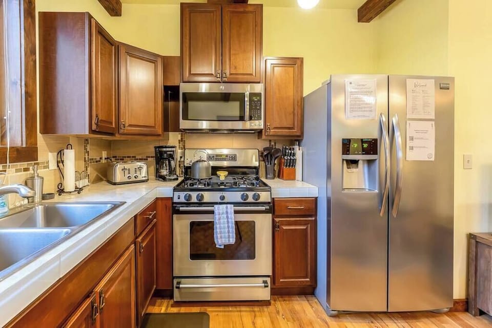 Full sized refrigerator and oven.