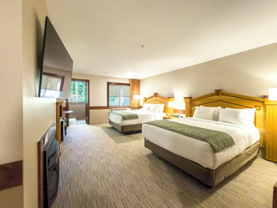 Deluxe Room, 2 Queen Beds, Fireplace | Individually furnished, desk, iron/ironing board, free cribs/infant beds