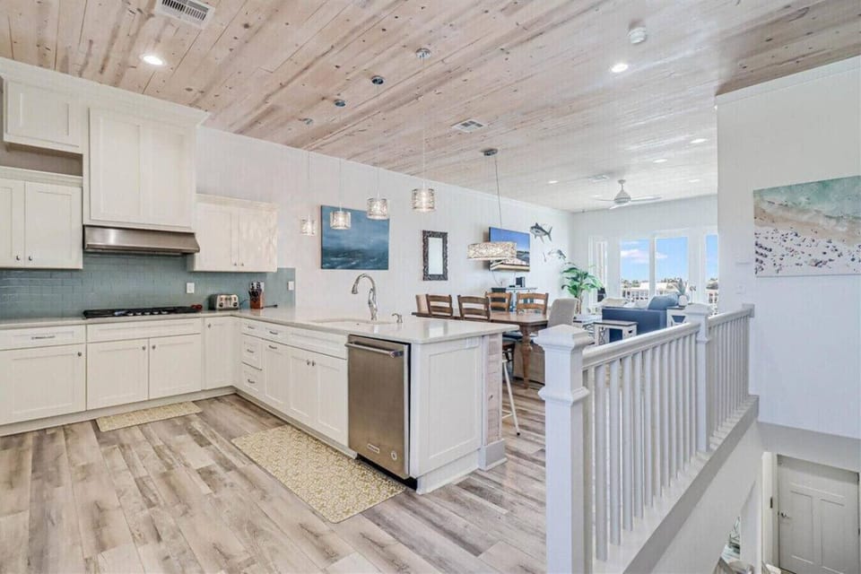 Fully Equipped Kitchen Overlooking Dining and Living Areas