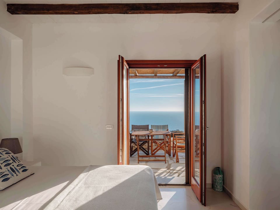 Wake up to natural light and island views from the open-plan living space.