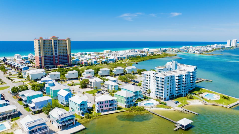 Located directly on the Little Lagoon in the Heart of Gulf Shores, only steps from the sugary-white sand beaches