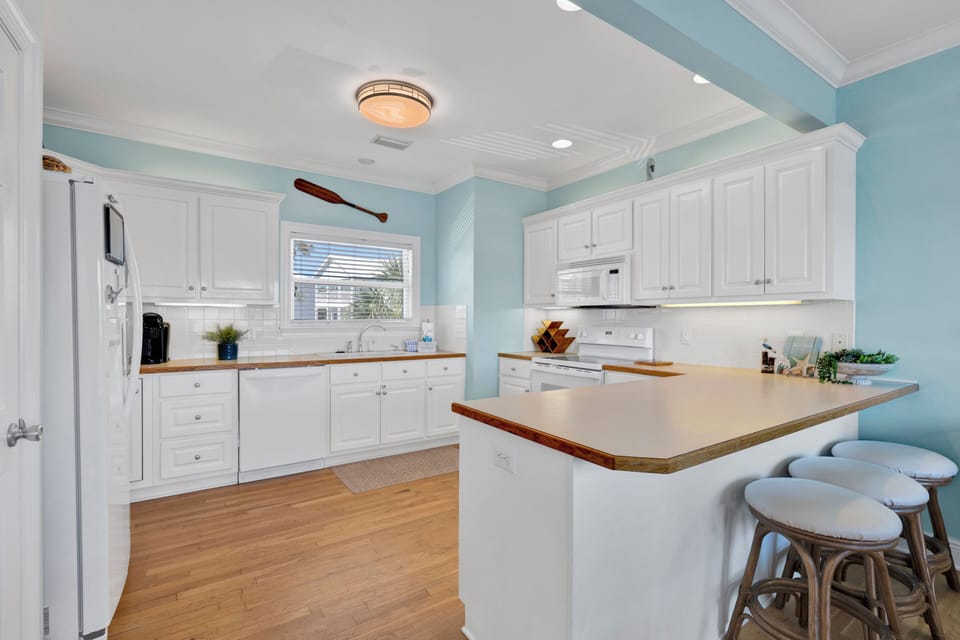 Bright, airy kitchen with bar-seating