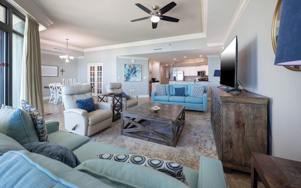 Feel at home in the inviting living area, surrounded by plush seating and vibrant decor, perfect for relaxation and