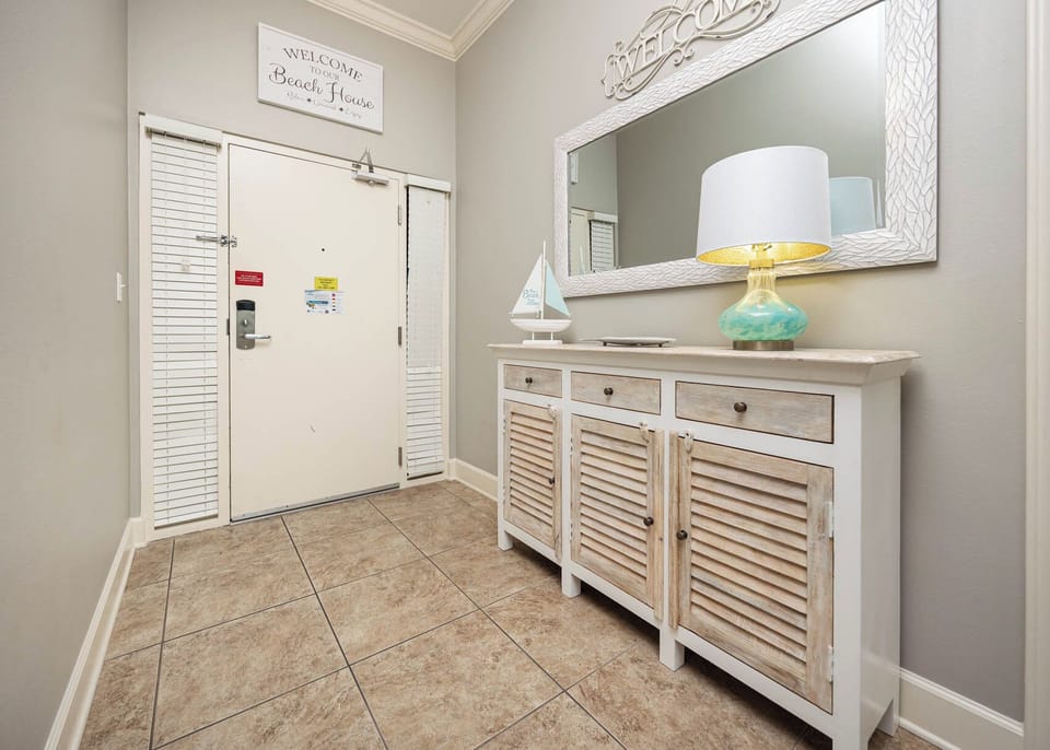 Welcome yourself into warmth as you step into your cozy entryway, ready to start your beach adventure