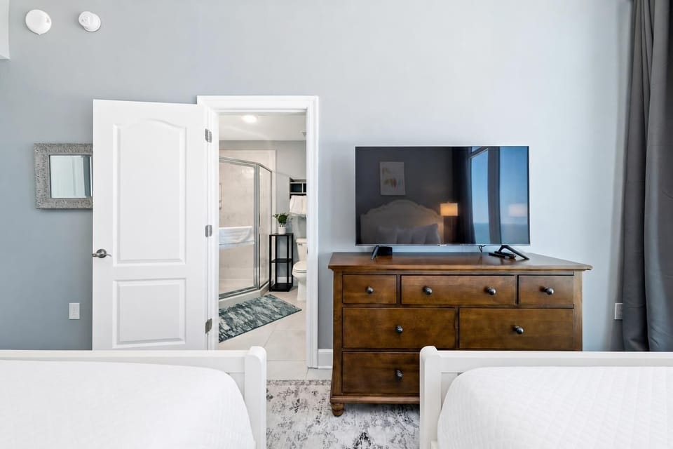 Relax on the queen beds in this guest suite, stream shows on the TV, and refresh in the en-suite shower