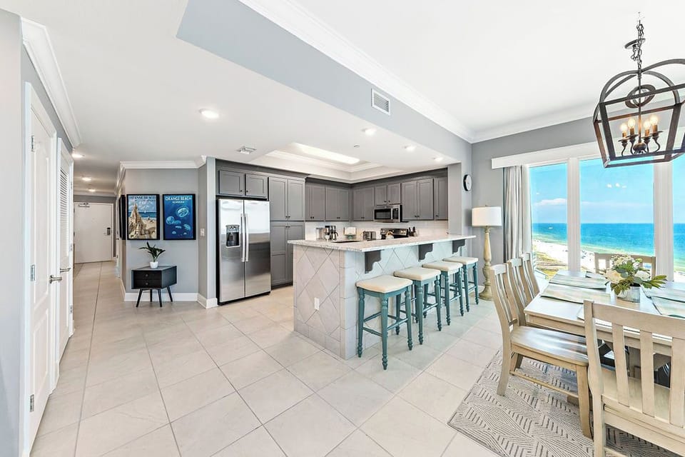 Enjoy this stylish kitchen space while the gulf glitters beyond the dining room windows
