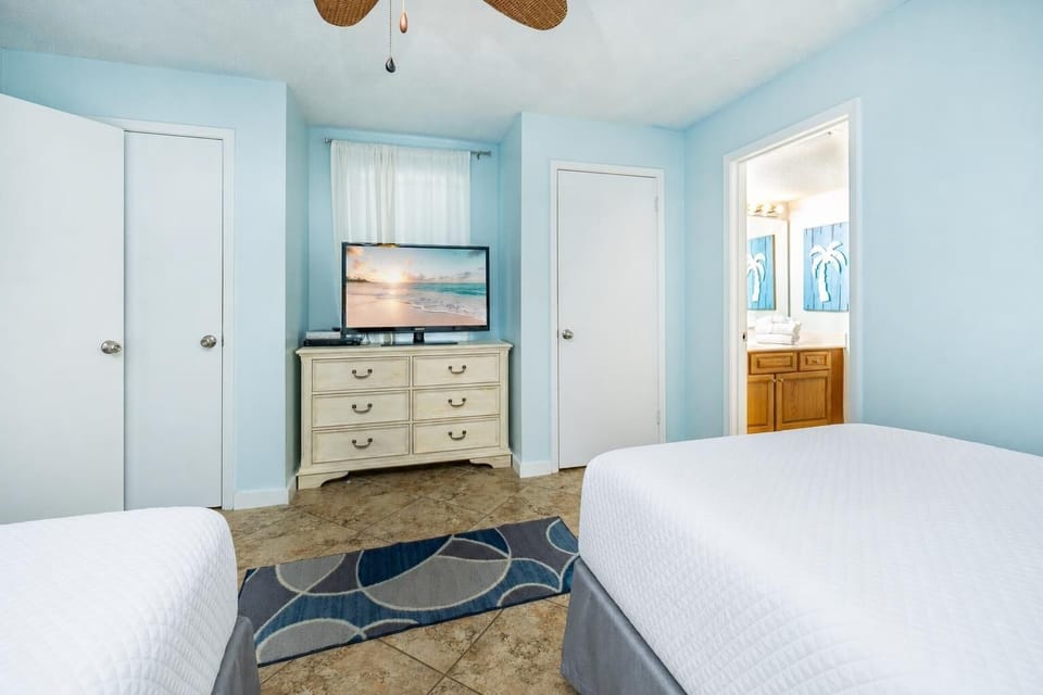 Experience comfort as you settle in this cozy guest bedroom, perfect for unwinding after a day at the beach