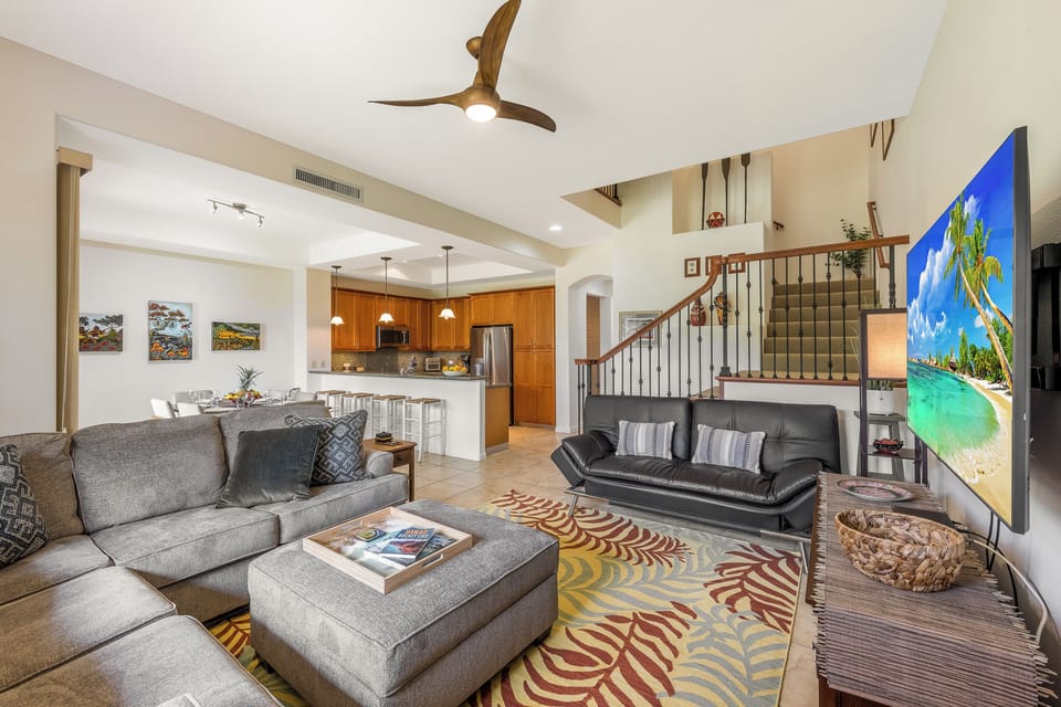 Relax in the updated living room with cozy seating and Smart TV for movie nights.