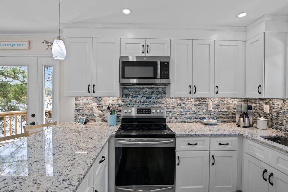 Step into our inspiring kitchen: modern amenities, elegant decor.
