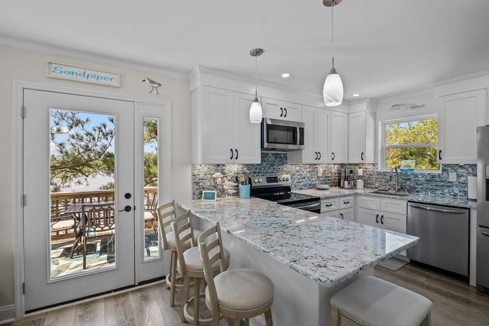 Discover convenience and style: Kitchen with seating bar.