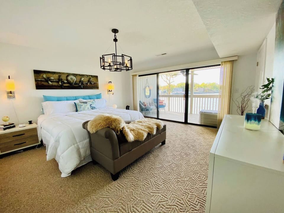 Escape to peaceful slumber in this lakefront king master suite.