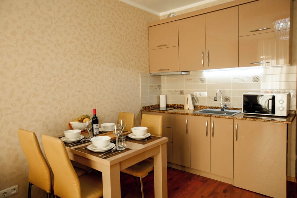 Premium Apartment | Living area | 40-inch Smart TV with cable channels