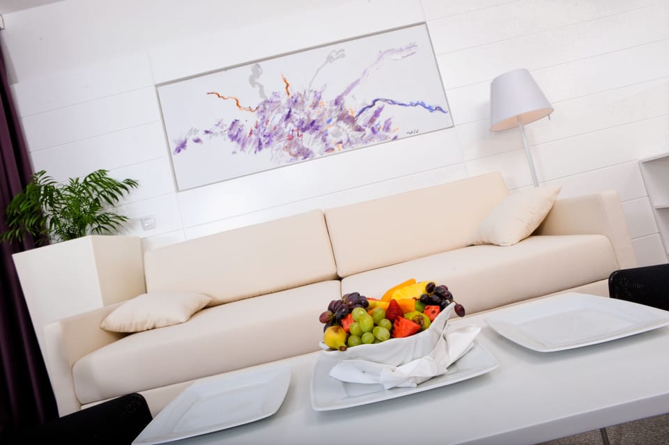 Deluxe Suite | Living room | Flat-screen TV