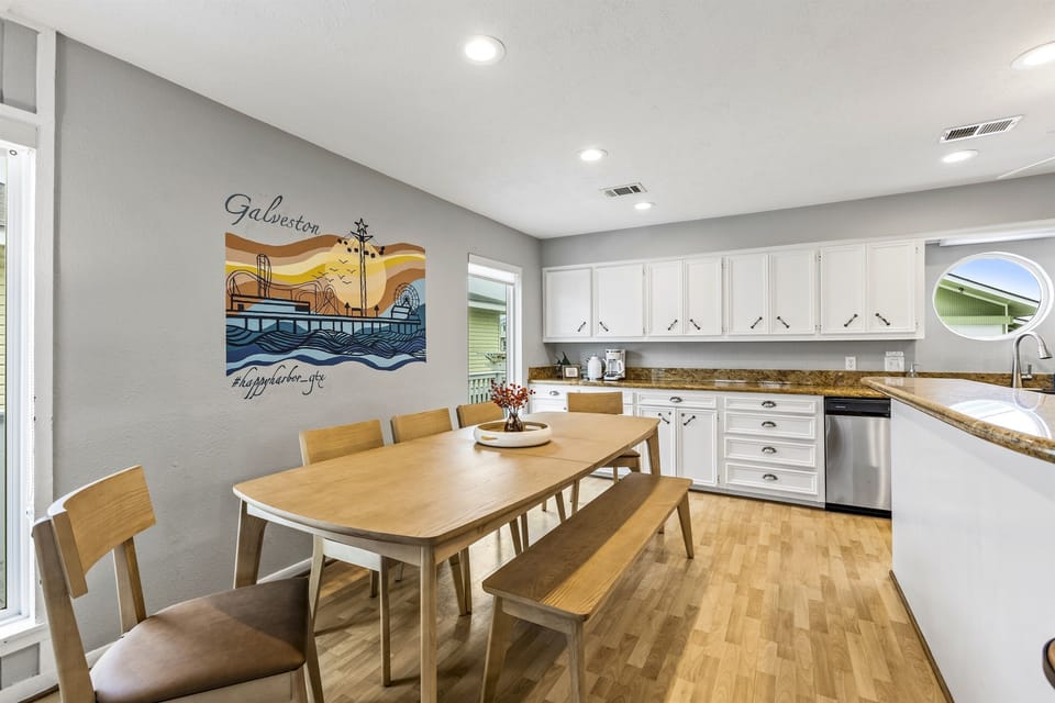 Dining table seats 9 plus 2 at the kitchen bar.