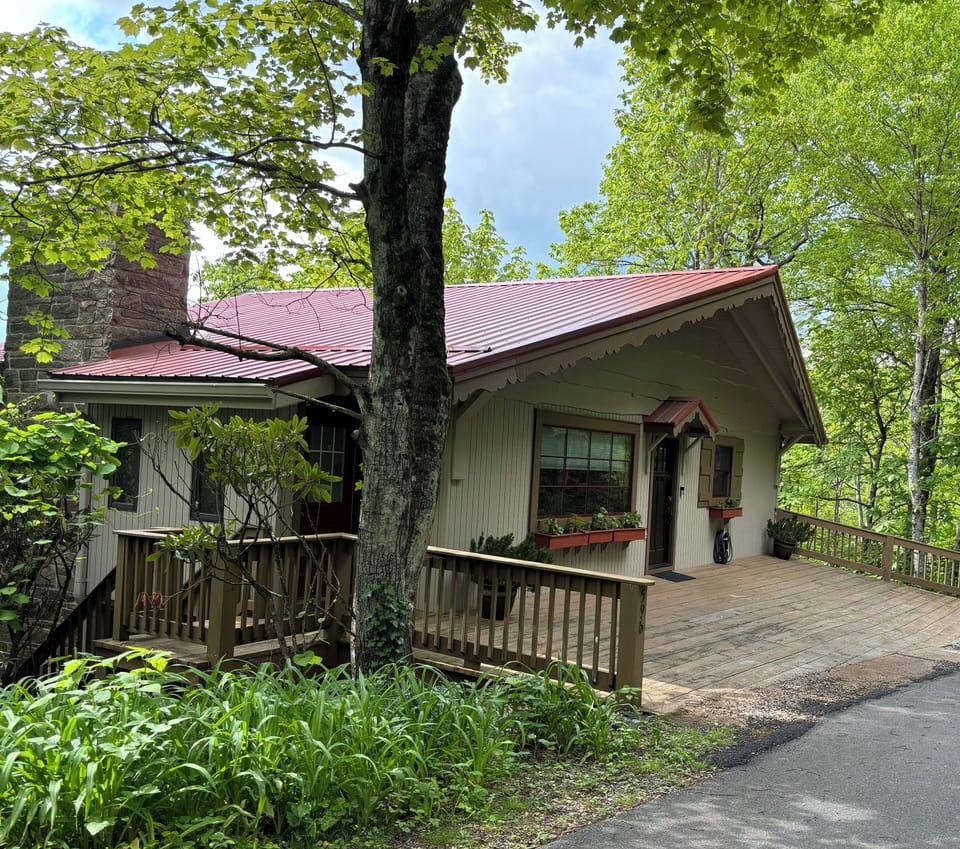 Front entrance with parking on deck and across the street.