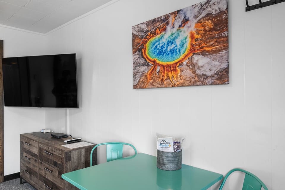 Table for two, flat screen Tv and large dresser