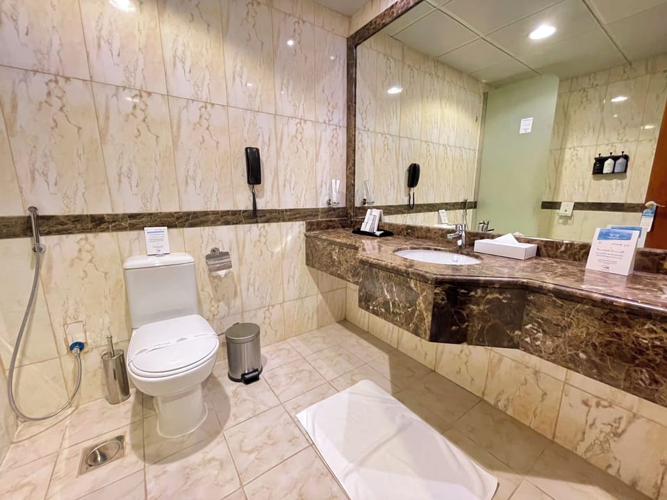 Separate tub and shower, hair dryer (on request), towels, soap