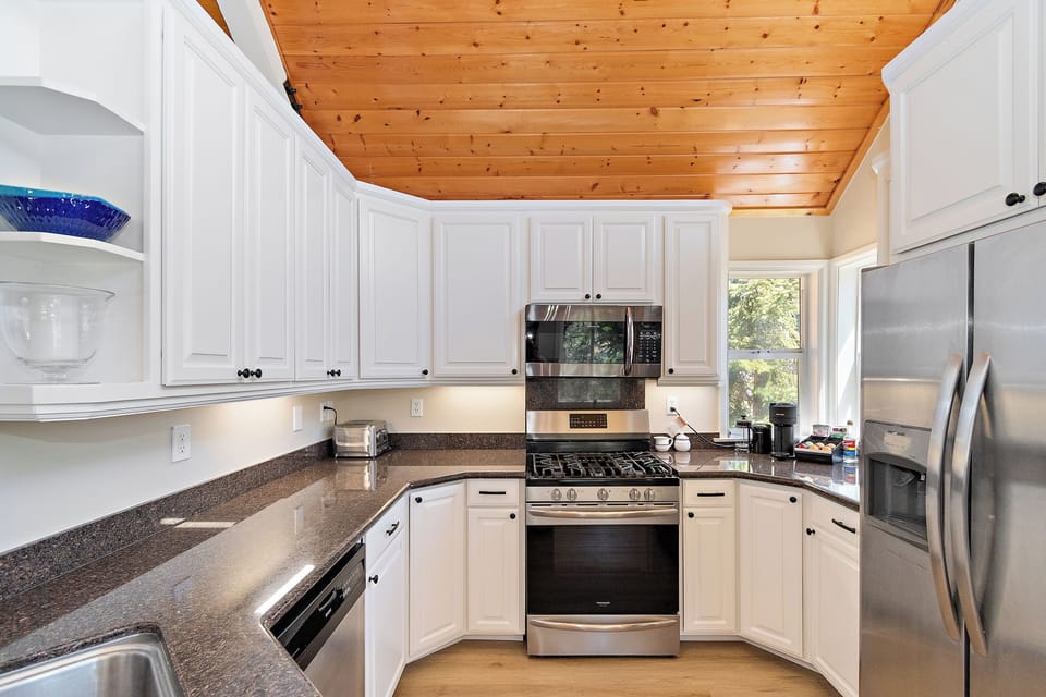 Cook favorite meals with ease in the fully equipped kitchen, featuring stainless steel appliances, generous counter space, and everything needed for cozy breakfasts or family dinners in Big Bear.