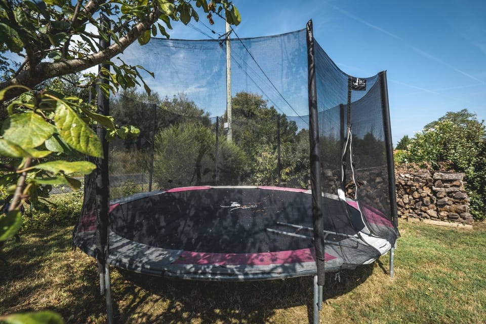 Outside: Large terraces - Tables - Charcoal BBQ - Above-ground swimming pool - Trampoline + Wooden play area for children.