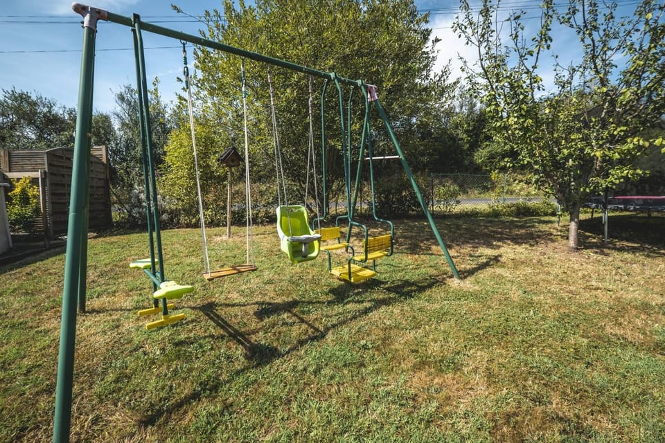 Outside: Large terraces - Tables - Charcoal BBQ - Above-ground swimming pool - Trampoline + Wooden play area for children.