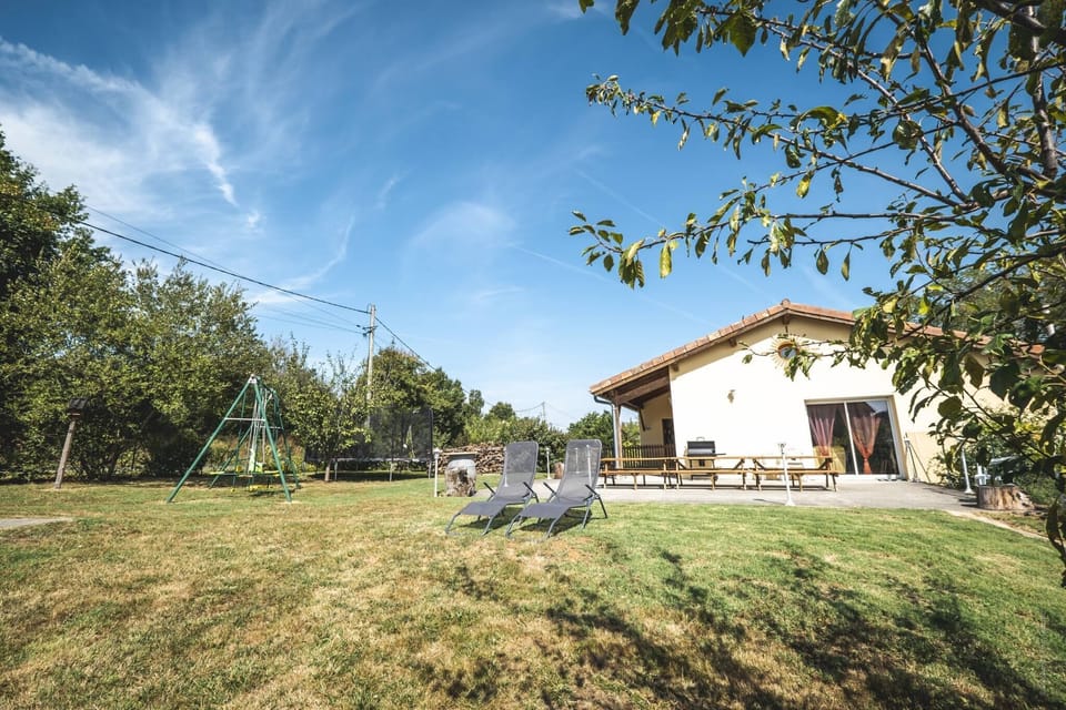 Outside: Large terraces - Tables - Charcoal BBQ - Above-ground swimming pool - Trampoline + Wooden play area for children.