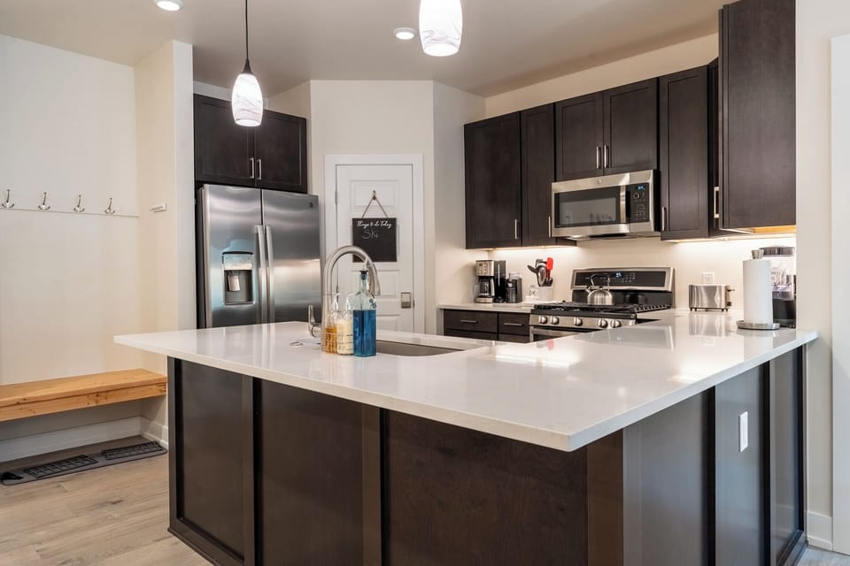 Your dream kitchen awaits with gleaming quartz countertops, stainless appliances, and plenty of space to create memorable meals together.