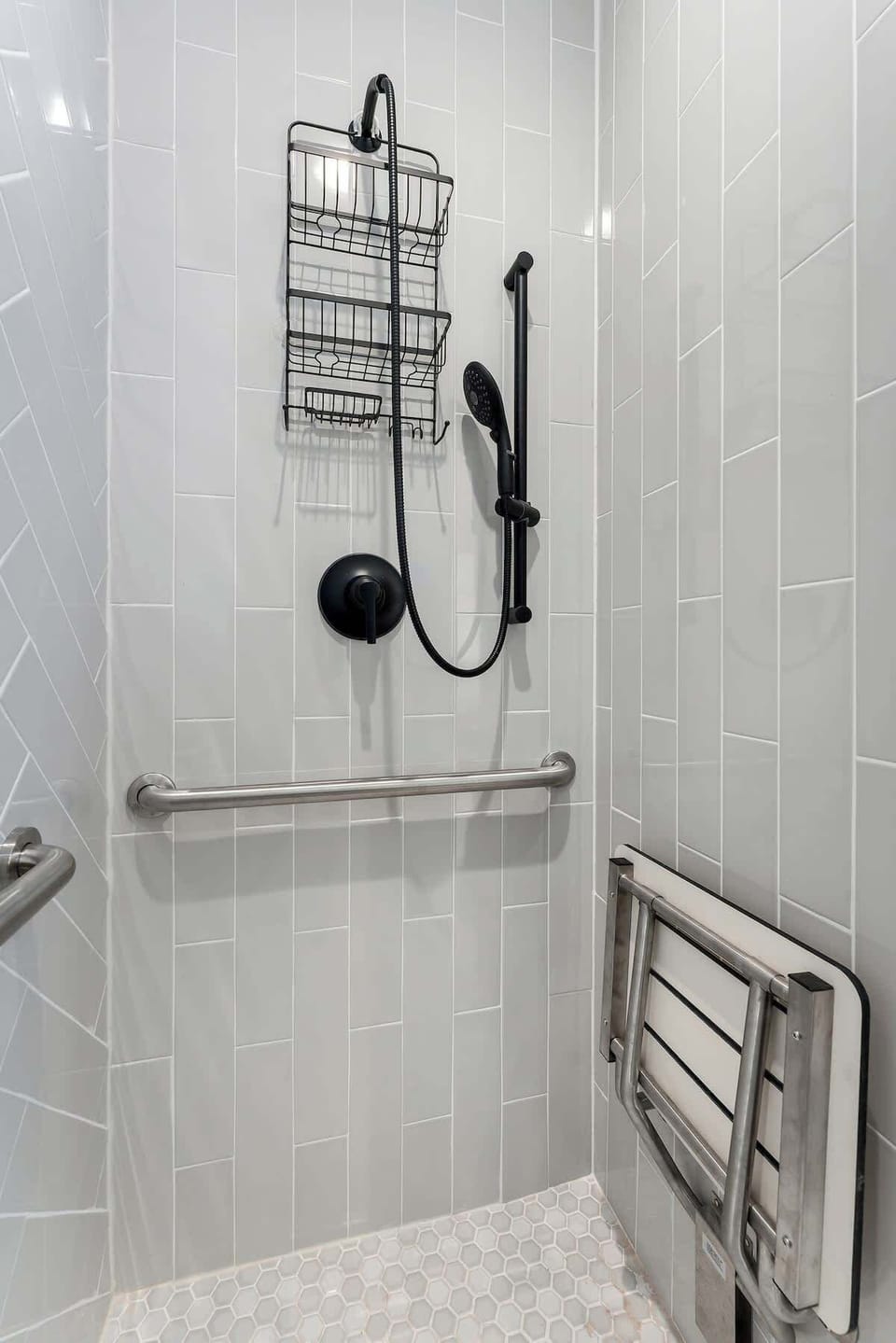 Bathroom two offers an ADA Compliant shower.