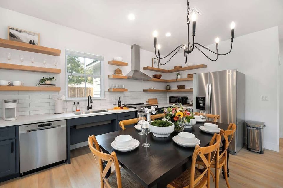 Large table opens to the kitchen to entertain.