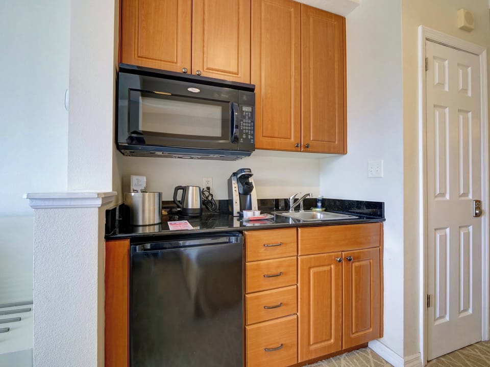 Premium Hotel room, two king beds, kitchenette, Wi-Fi, desk, Full Tile Bath