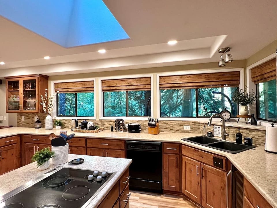 Expansive Kitchen with a view of Back Deck and Sandy River
