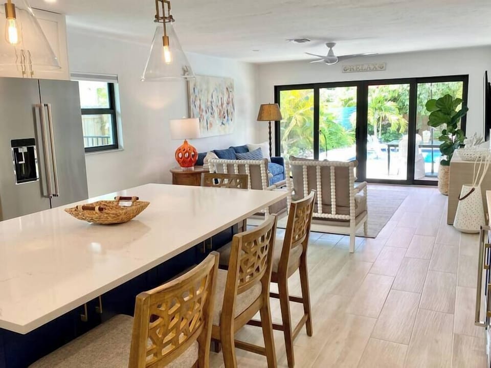 Designed with a wide open floor plan and gorgeous views of the backyard oasis