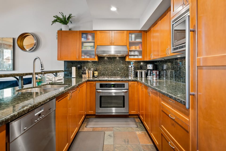 Well stocked kitchen with stainless appliances and dishwasher