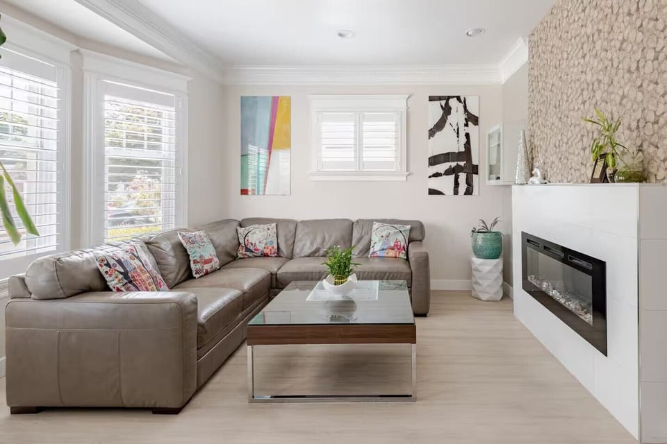 Living room: Relax in the modern  living room with a spacious leather sectional.