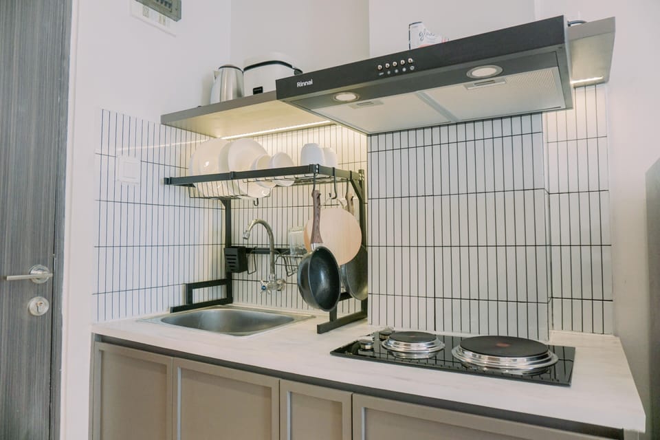 Full-size fridge, stovetop, rice cooker, cookware/dishes/utensils