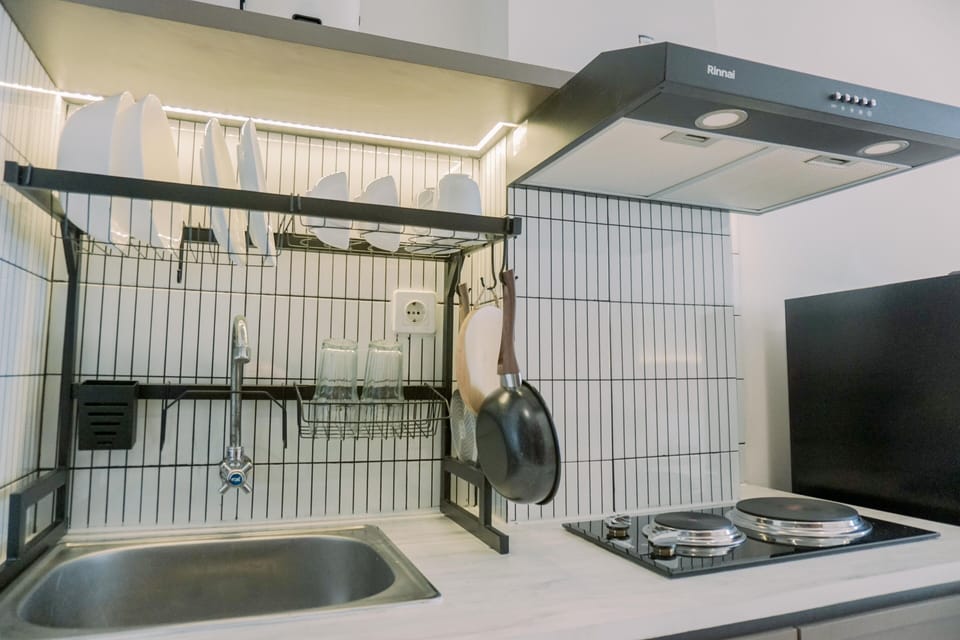 Full-size fridge, stovetop, rice cooker, cookware/dishes/utensils