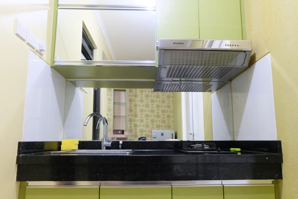 Full-size fridge, stovetop, rice cooker, cookware/dishes/utensils