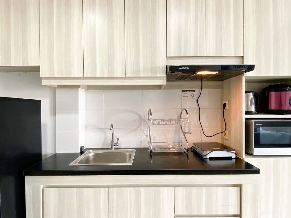Full-size fridge, stovetop, rice cooker, cookware/dishes/utensils