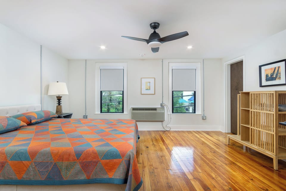 Spacious primary bedroom with king-size bed.