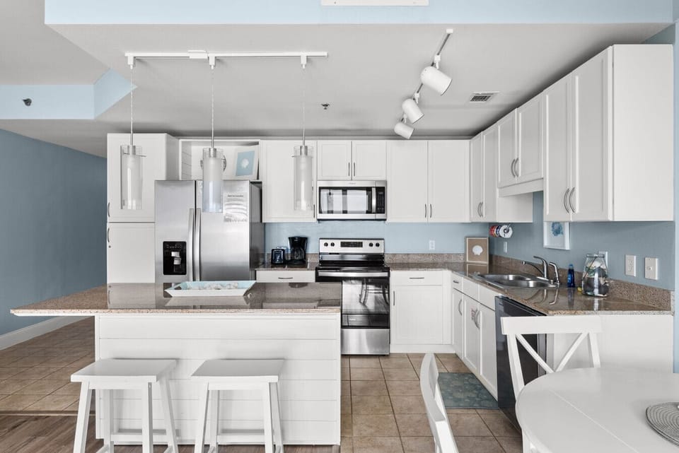 Fully equipped kitchen with modern appliances and plenty of counter space for easy meal prep.