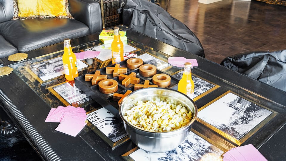 Game night ready: popcorn, cards, and tic-tac-toe on deck