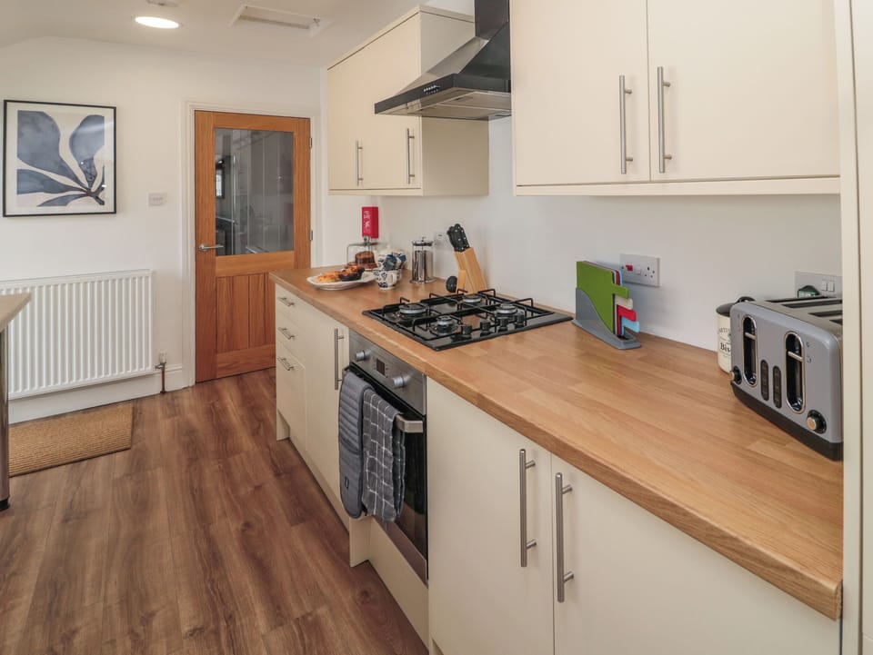 Fridge, electric kettle, toaster, cookware/dishes/utensils