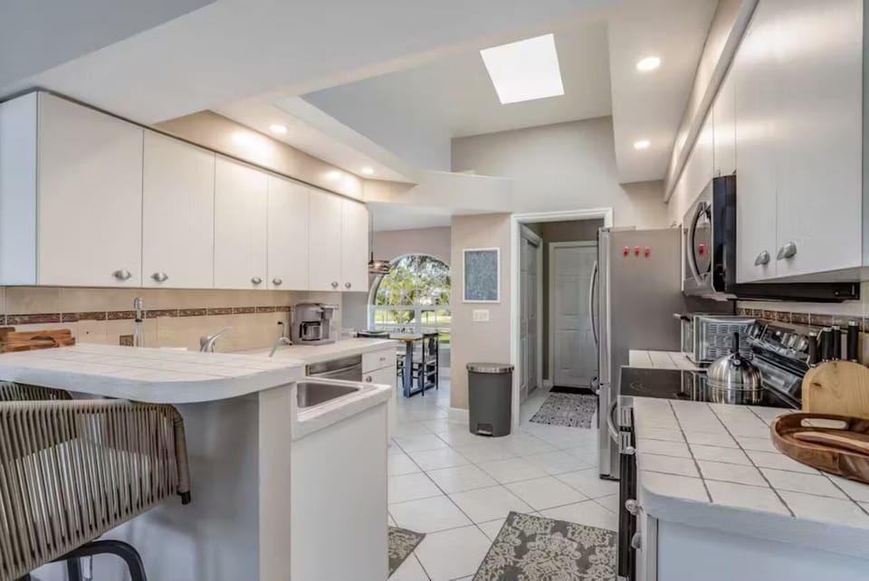 skylight allows for natural light to flood the kitchen
