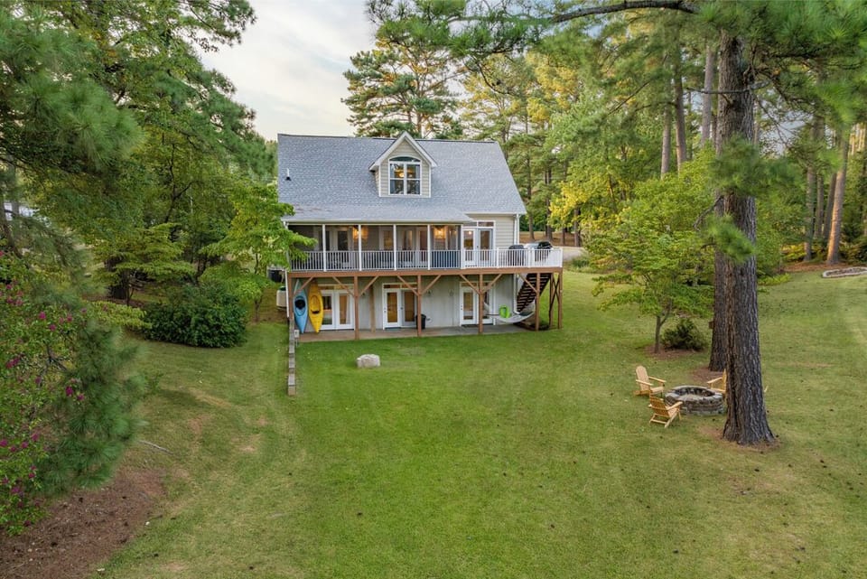Nice yard with a firepit and Kayaks and Paddles