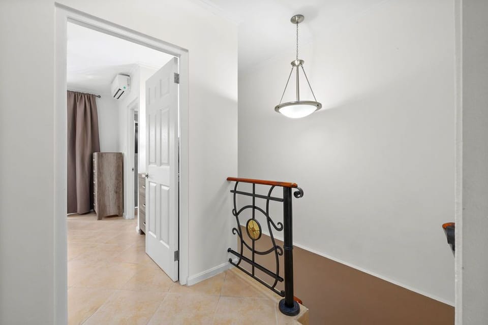 Ascend to comfort and style with our inviting staircase, guiding you to a world of relaxation and luxury.