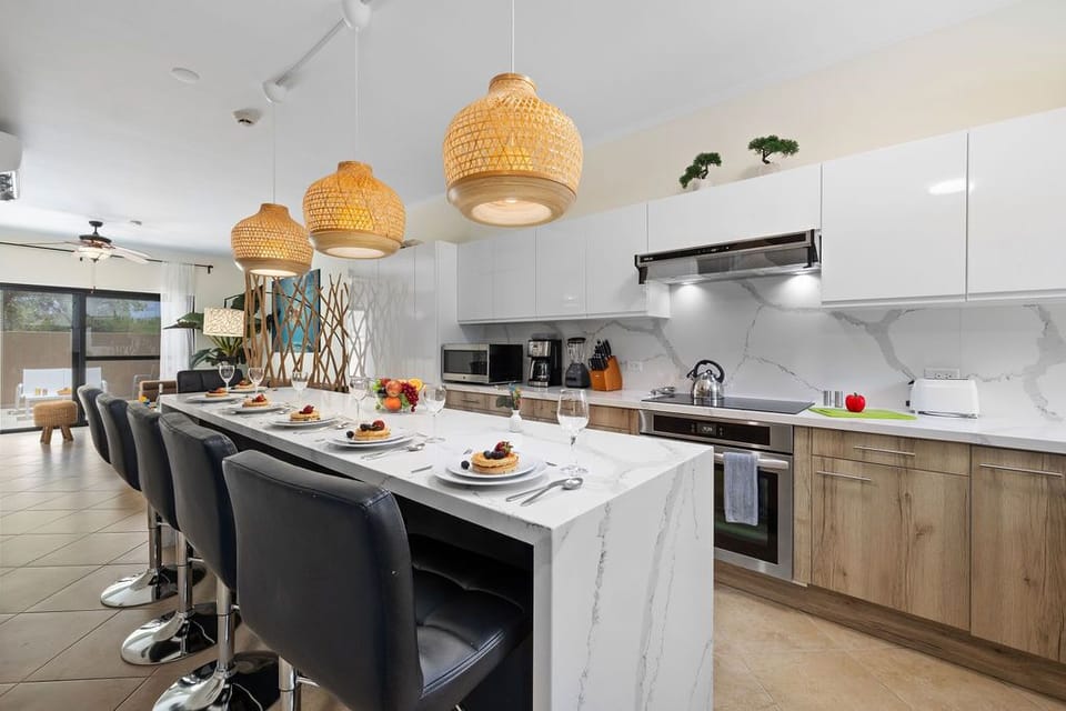 Entertain in elegance at our dining kitchen island. Whether it's breakfast with the family or cocktails with friends, our ample seating ensures everyone has a seat at the table.