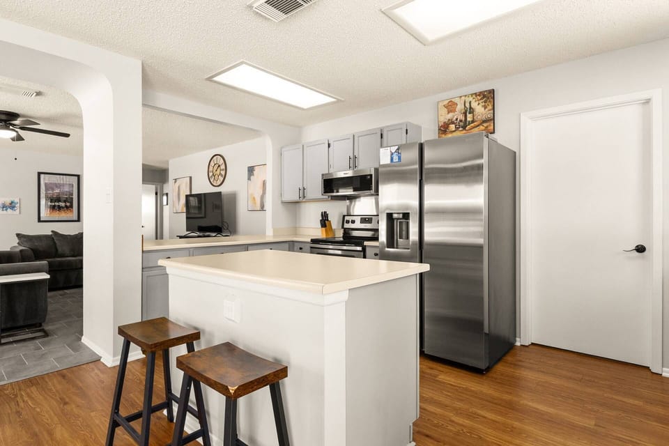 Kitchen island with seating—perfect for morning coffee or quick snacks before exploring San Antonio.