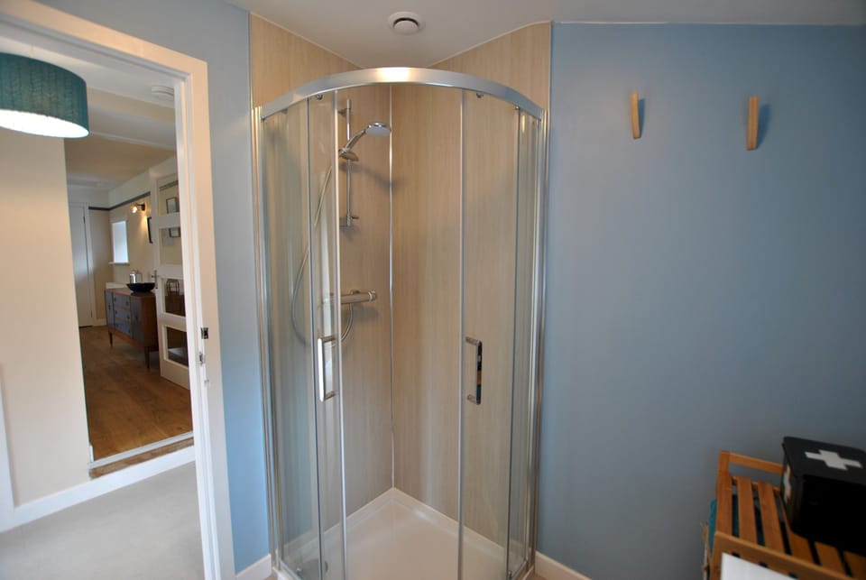 The modern shower room is fresh and bright